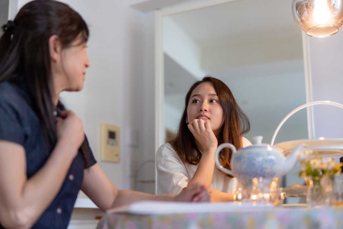 A mother and daughter are talking