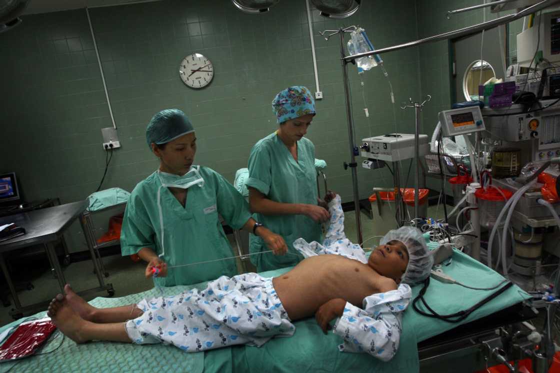 A boy is being operated upon in the theatre A boy is being operated upon in the theatre