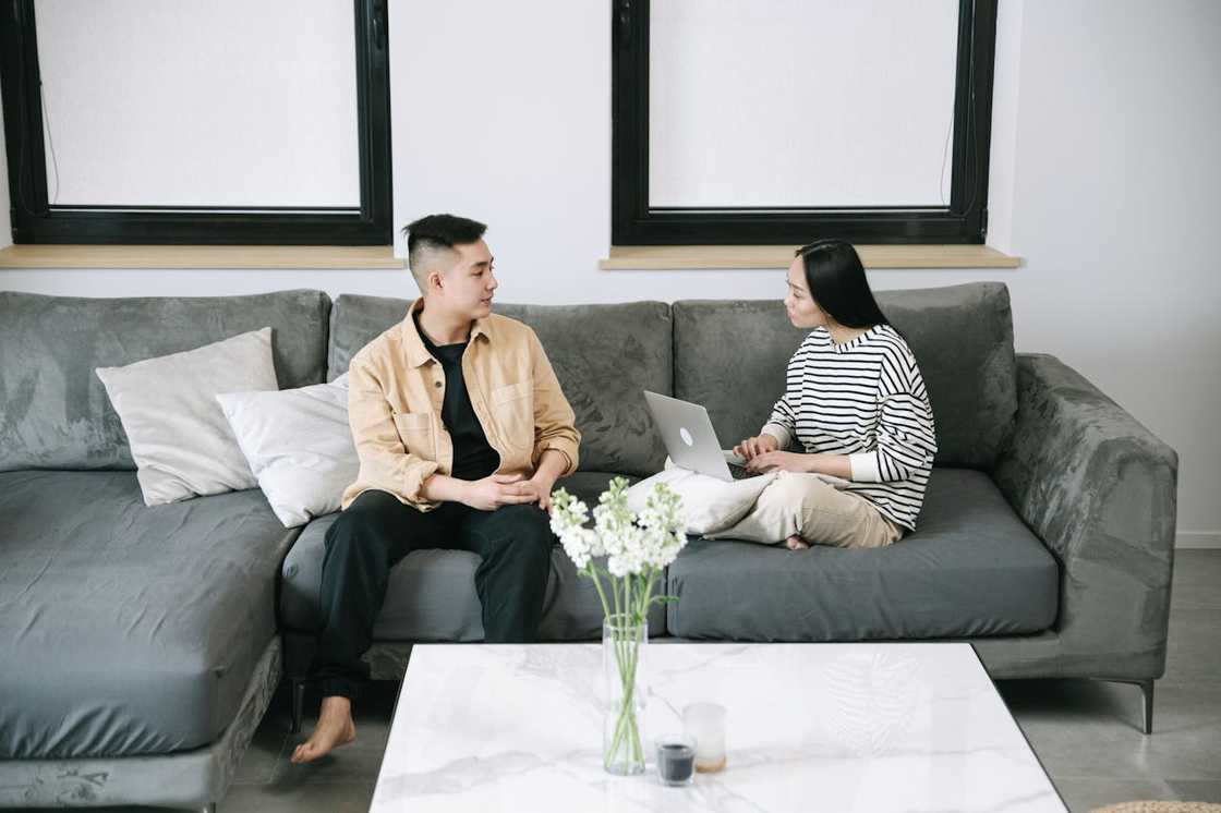 Parents talking at night in the living room. Parents talking at night in the living room.