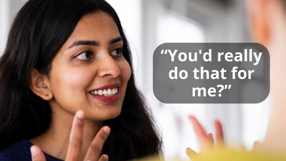 A woman talking with a friend indoors
