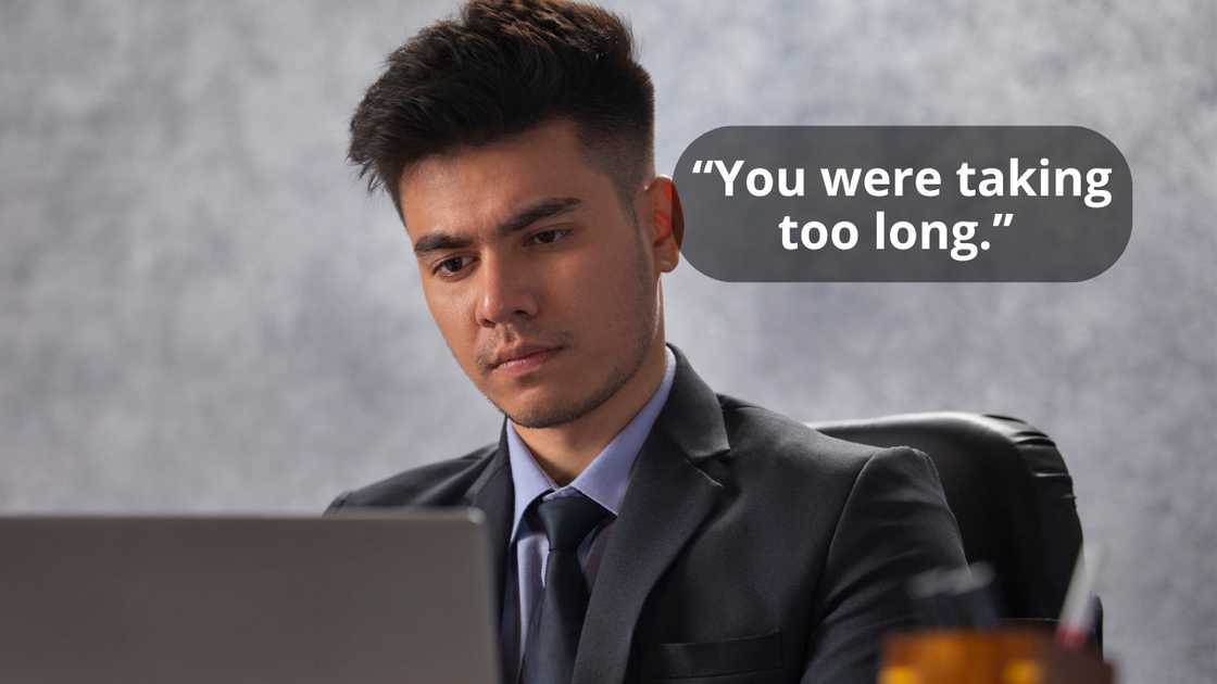 A young businessman working on laptop at his desk in office