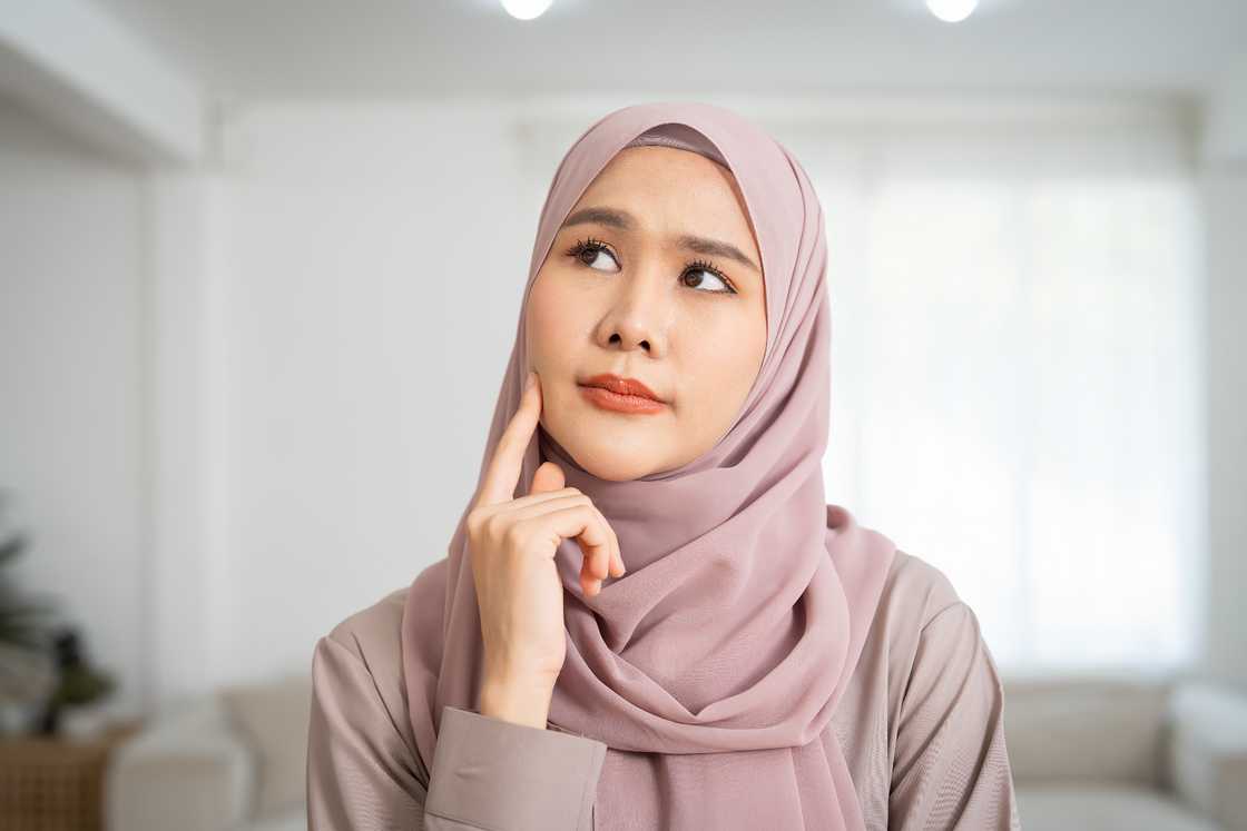 Woman in a hijab is thinking Woman in a hijab is thinking