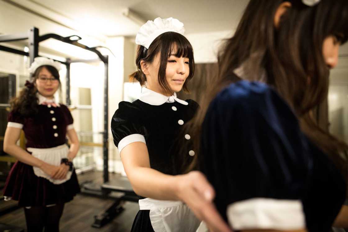 Housemaid working outdoor. Housemaid working outdoor.