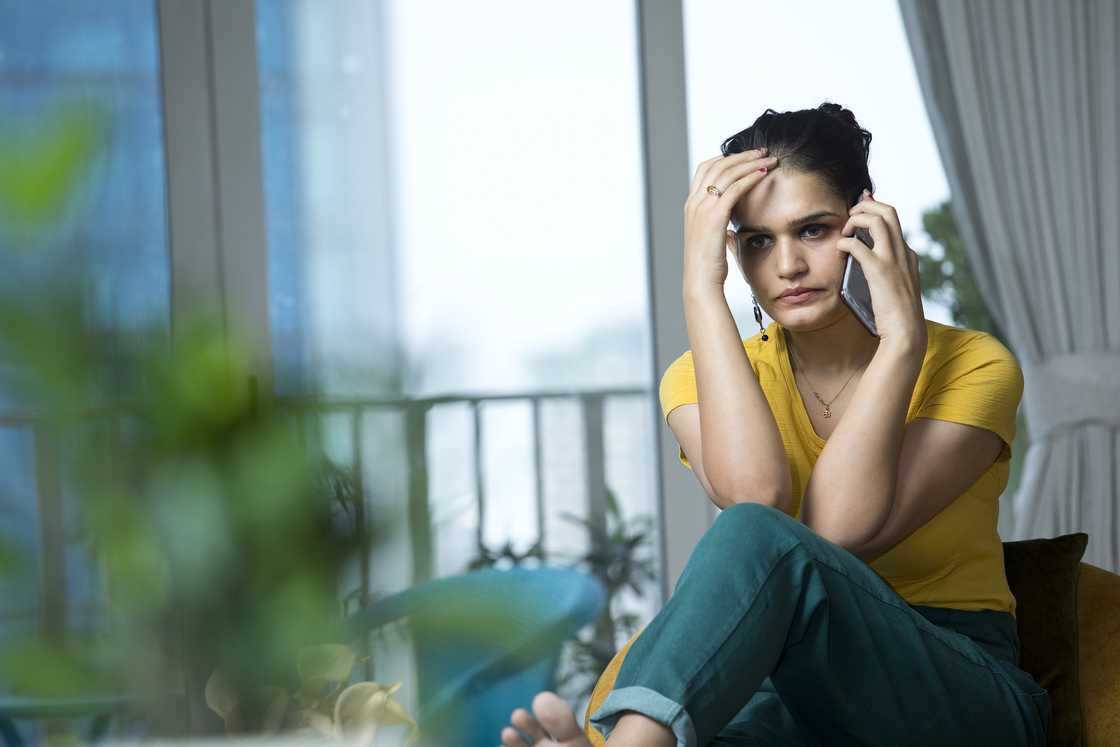 A worried young woman on a call
