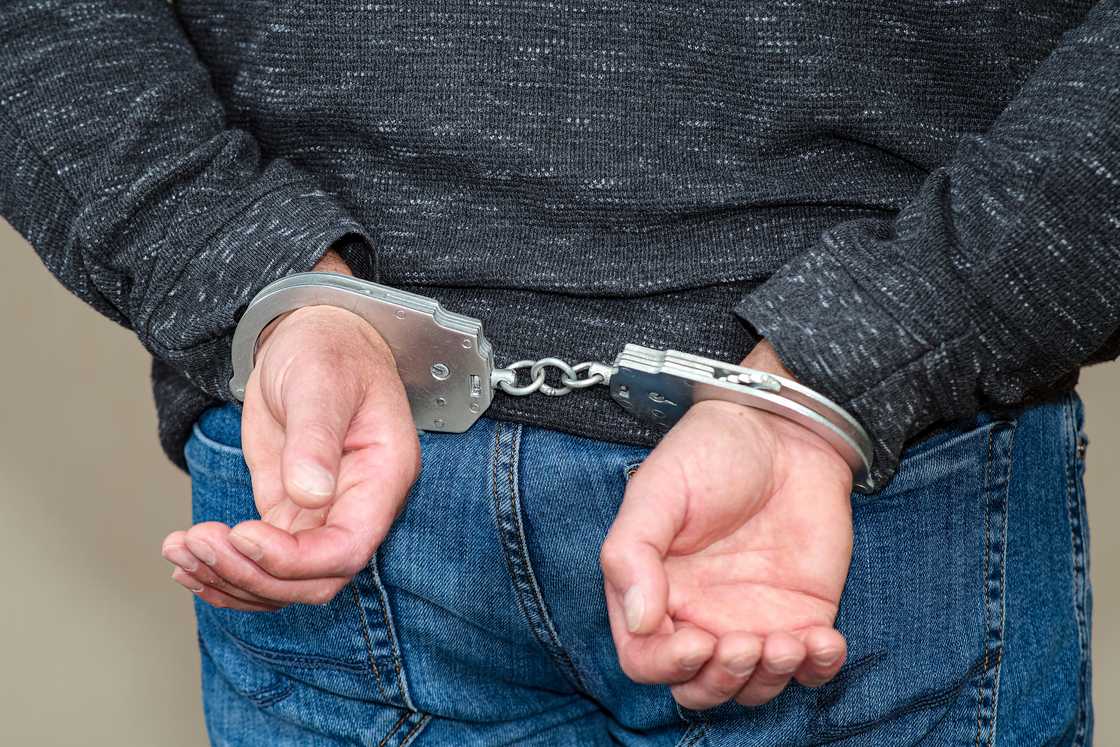 A man in hand cuffs A man in hand cuffs