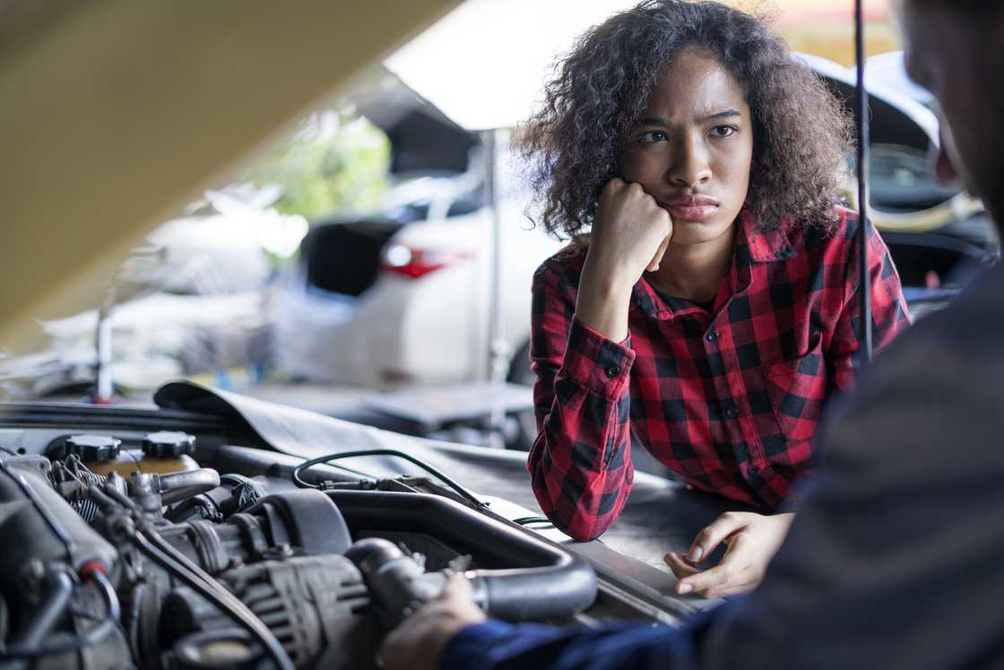 A stressed female mechanic A stressed female mechanic