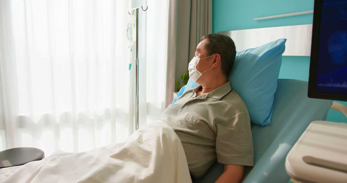 A patient in a hospital bed A patient in a hospital bed