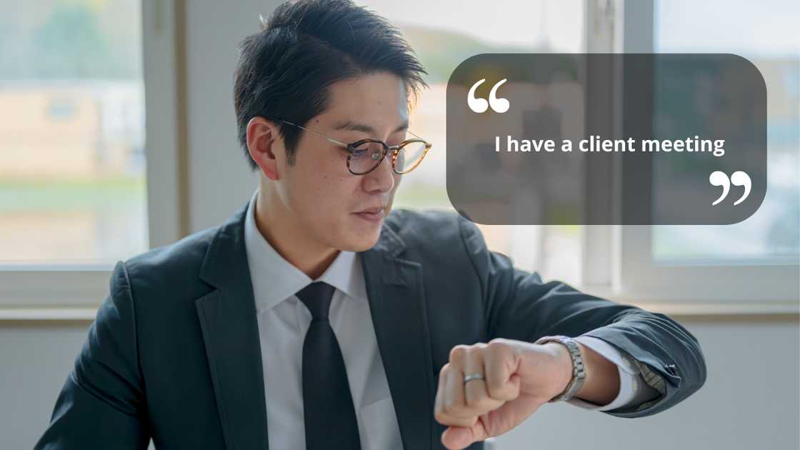 A man looking at his wristwatch