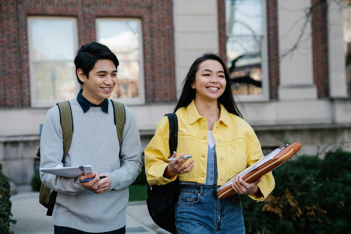 Two students walking together outdoors