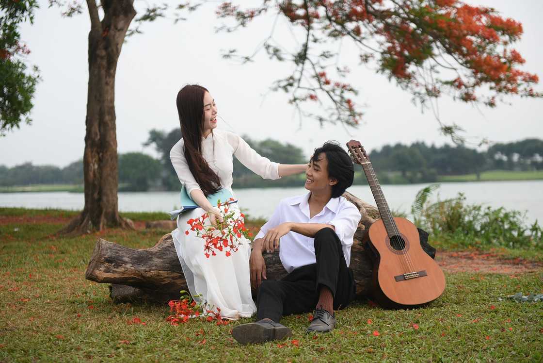 A couple sitting in a park A couple sitting in a park