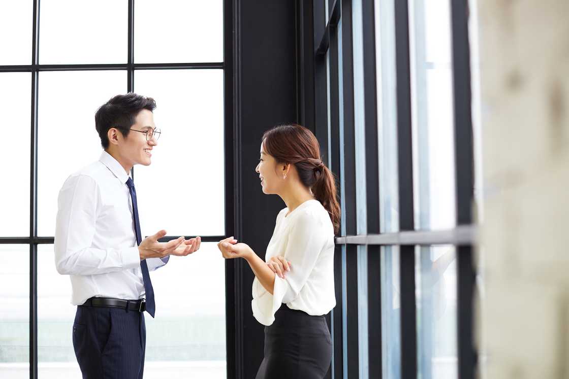 A lady and a man are talking A lady and a man are talking