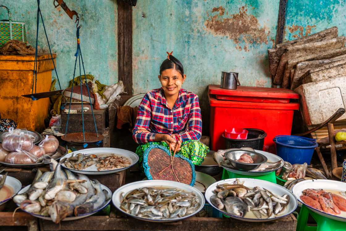 A woman is selling fish