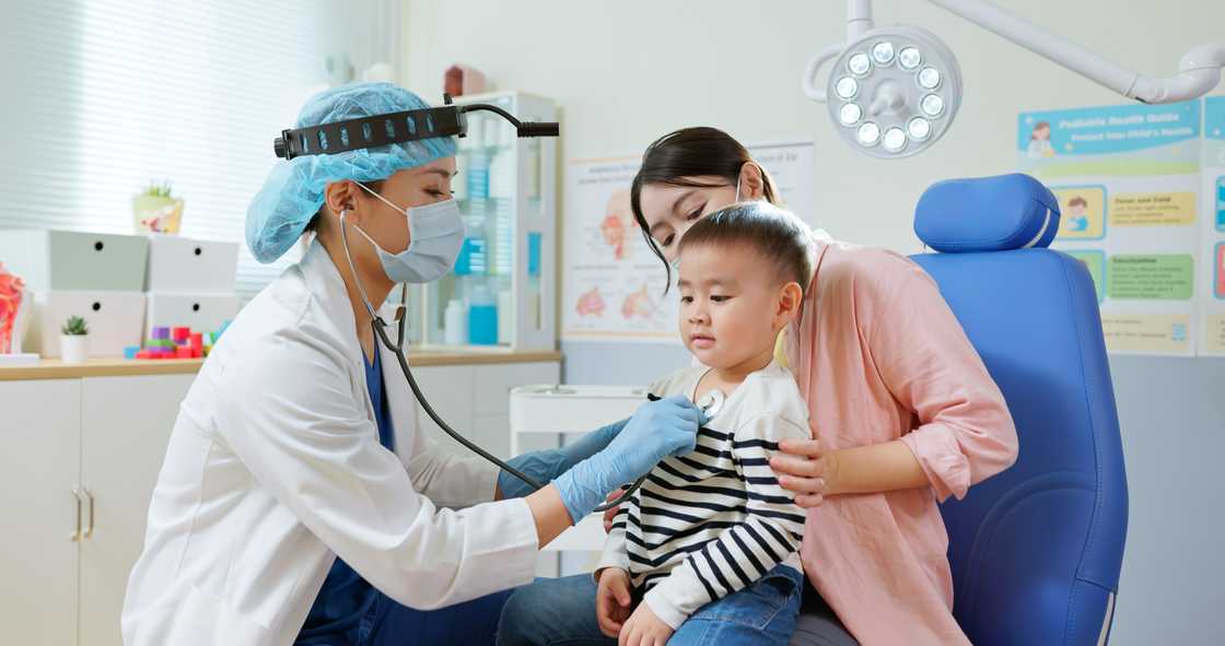 A baby during a hospital appointment A baby during a hospital appointment
