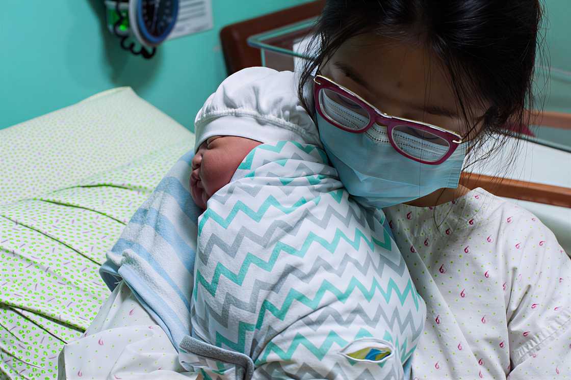 A portrait of a mother and newborn baby A portrait of a mother and newborn baby