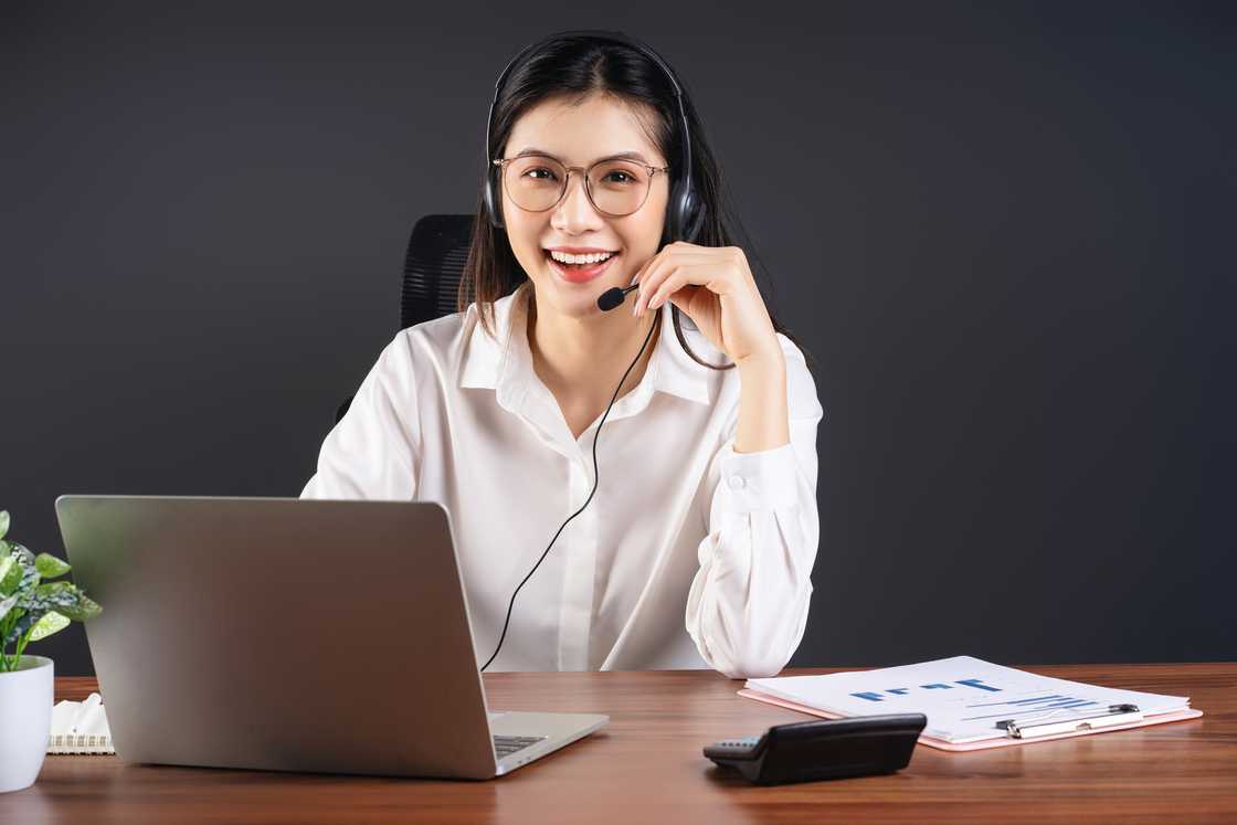A Filipina call centre agent listens during a long late-night call.