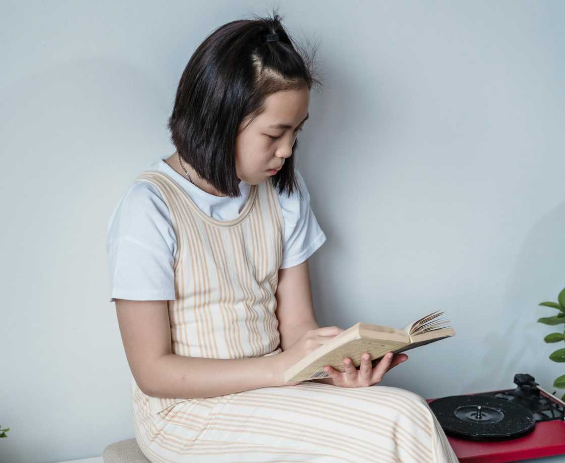 A girl reading a journal