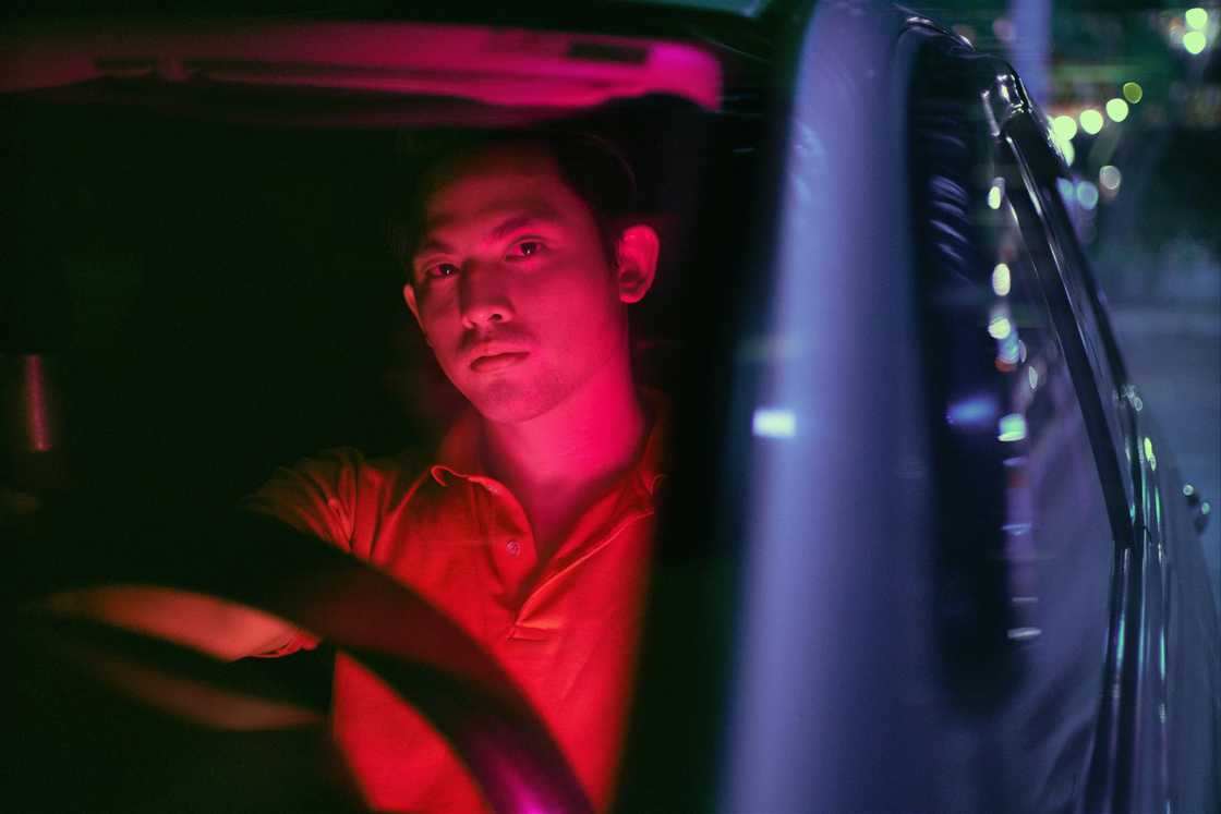 A man in a car at night A man in a car at night