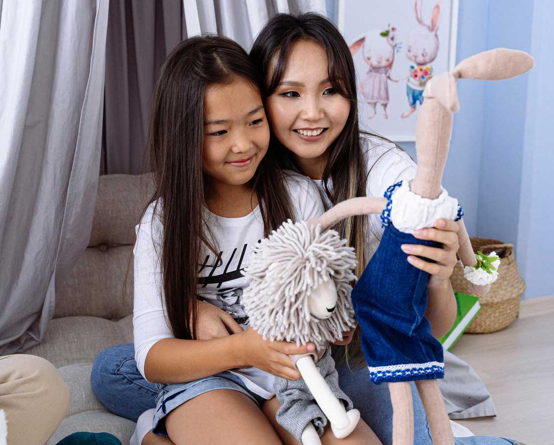 A happy woman holding her daughter