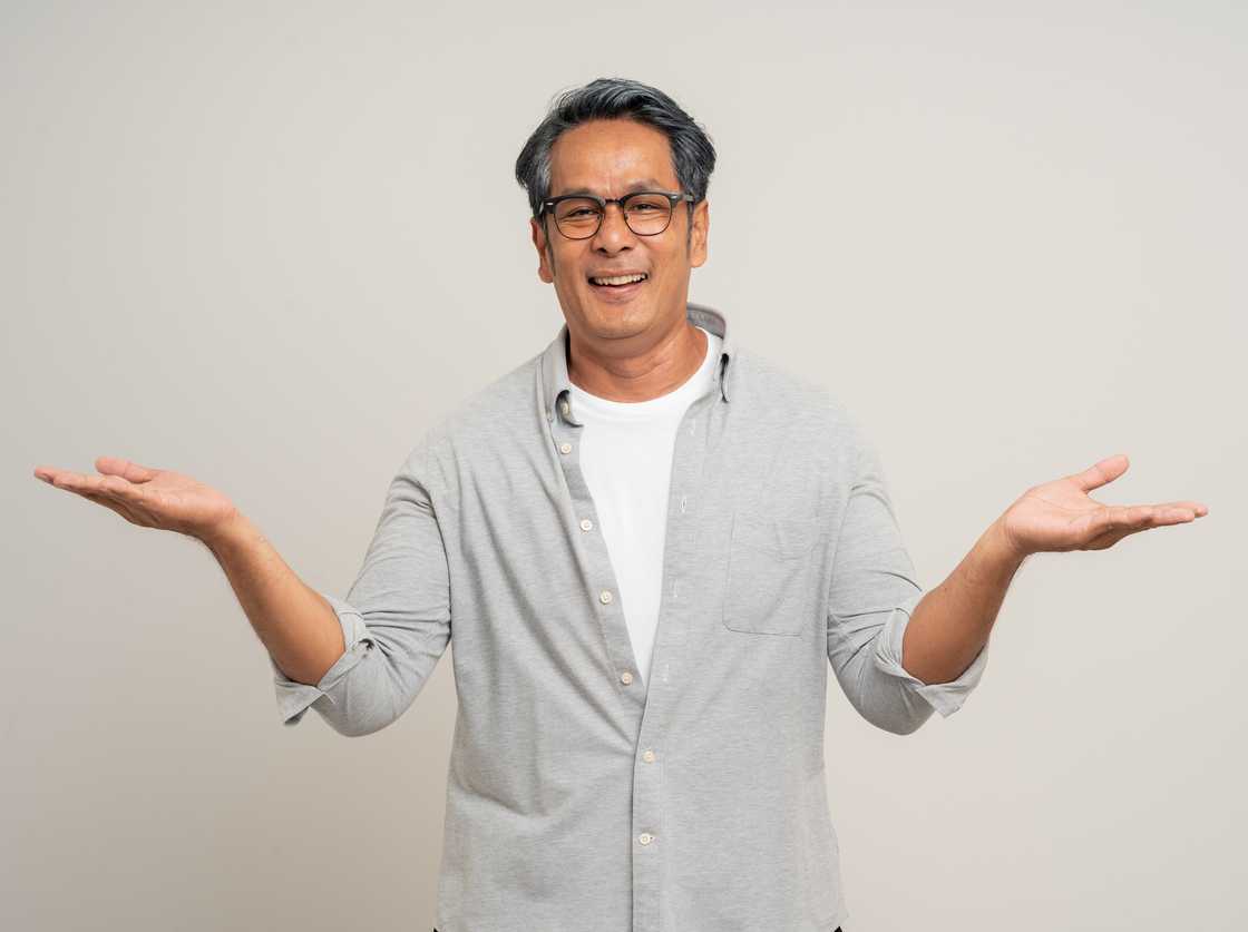 A man shrugging his shoulders A man shrugging his shoulders