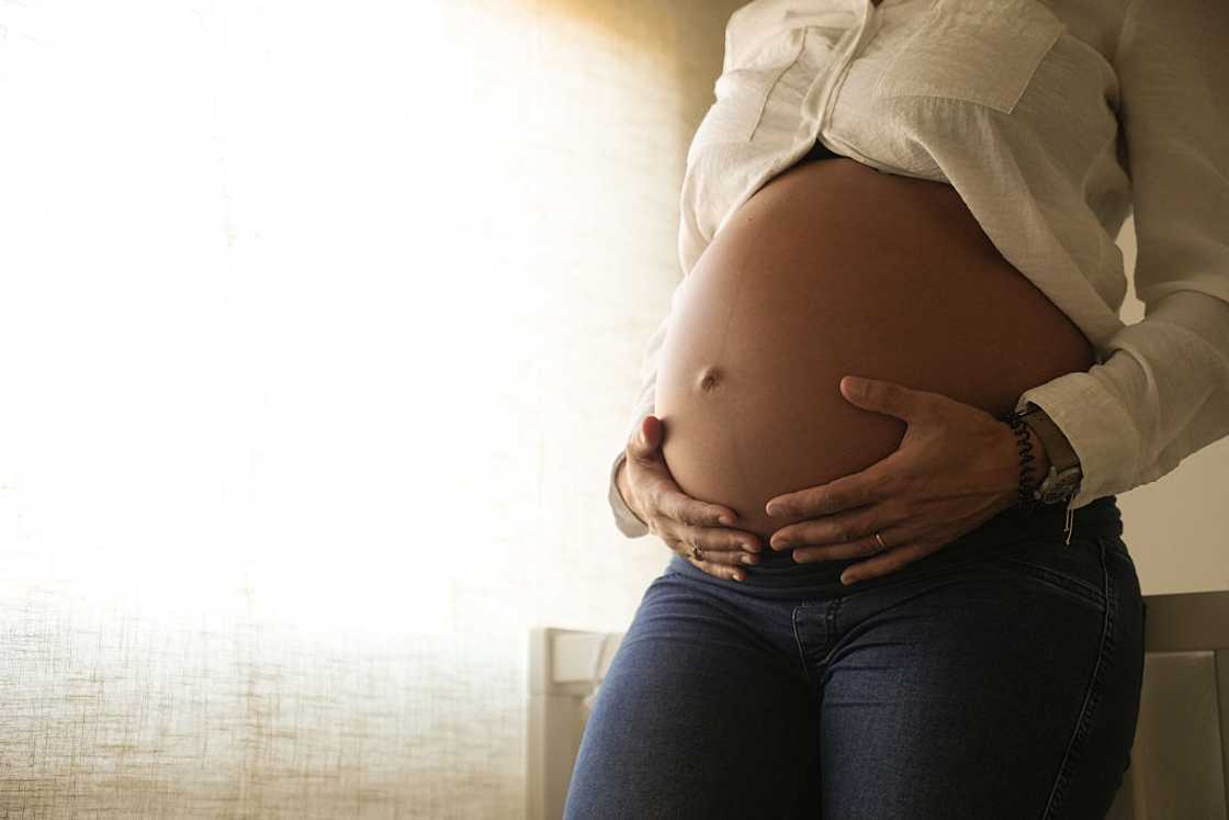 Heavily pregnant woman Heavily pregnant woman