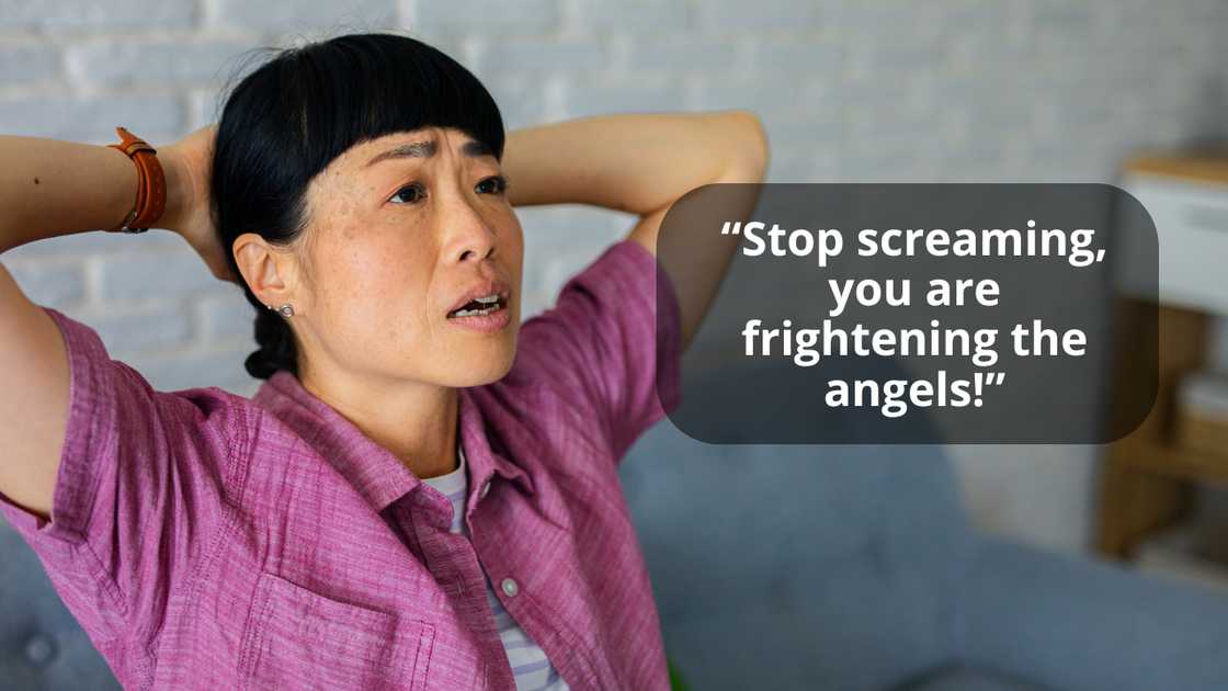 A distressed woman talking in panic, holding her head A distressed woman talking in panic, holding her head