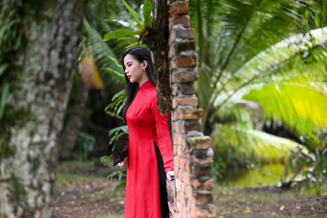 Filipino woman outdoor in red dress Filipino woman outdoor in red dress