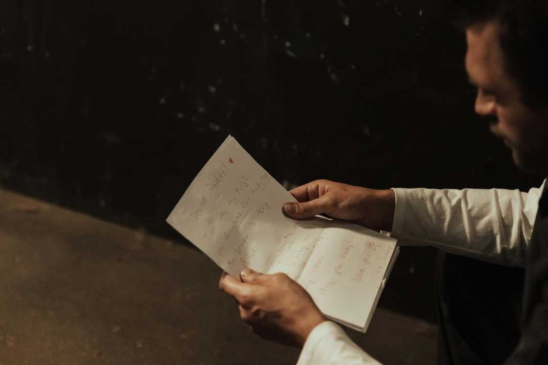 A man reading a note A man reading a note