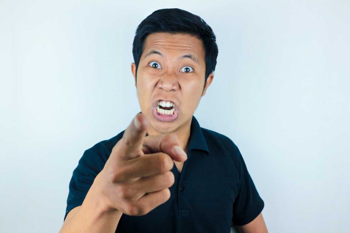 An angry man pointing at camera An angry man pointing at camera