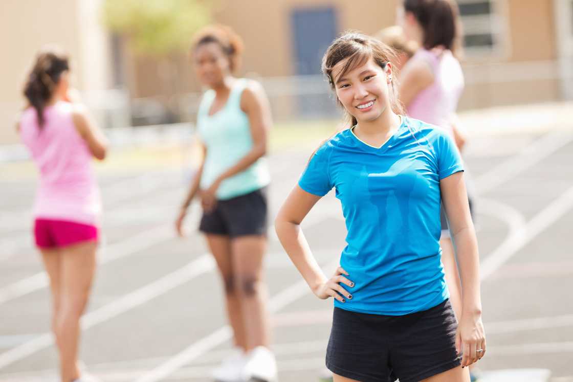 A teen athlete smiling after winning a race A teen athlete smiling after winning a race