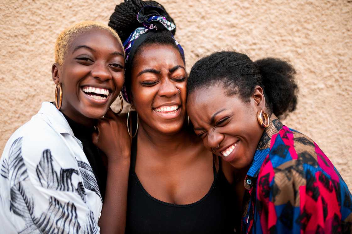 Three beautiful women laughing.