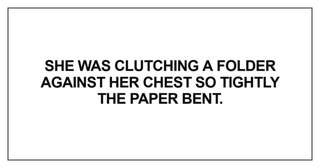 She was clutching a folder against her