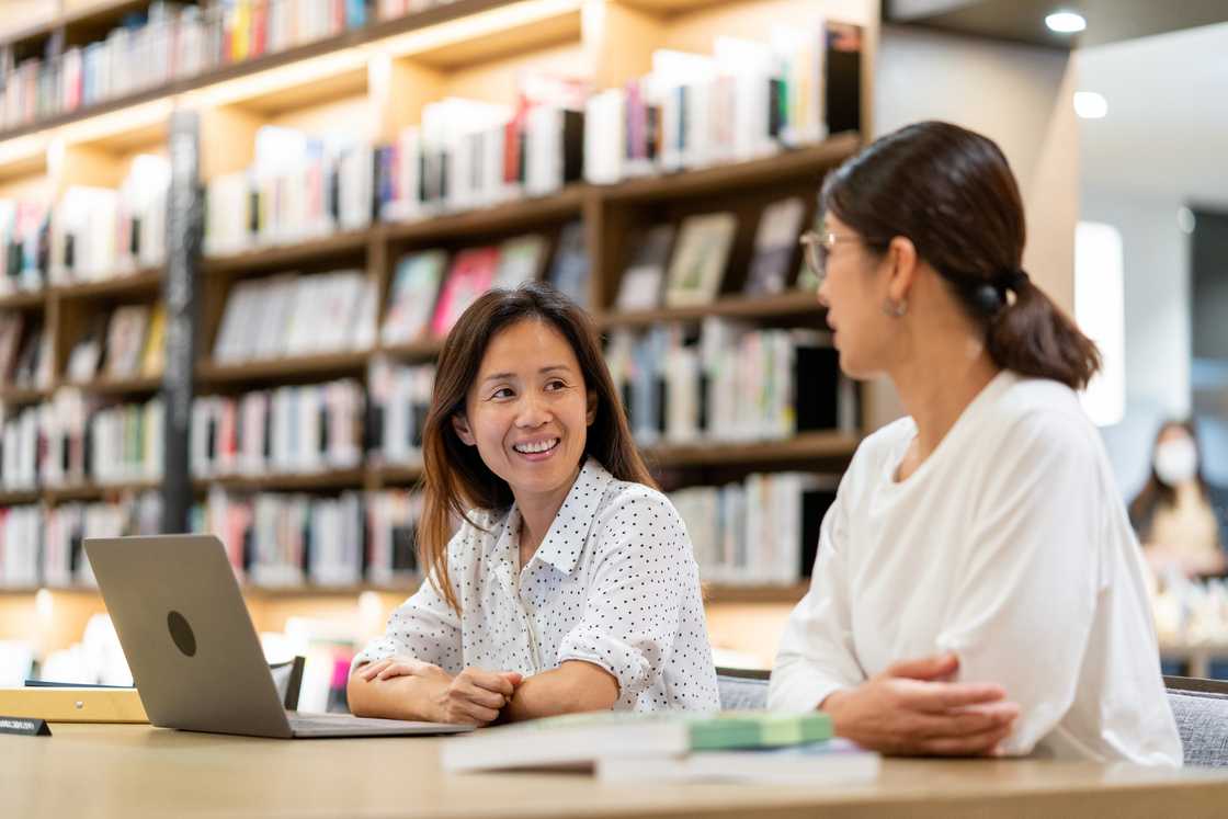 two students in a university library two students in a university library