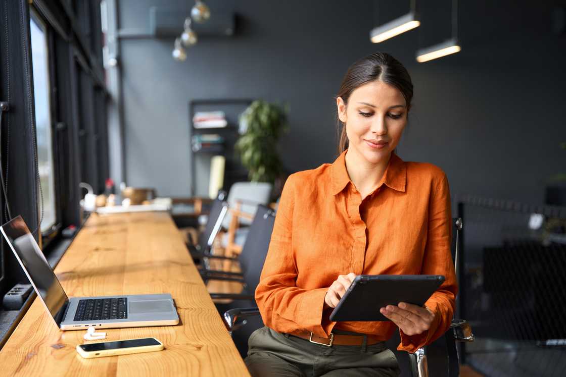 A happy woman smiling at work