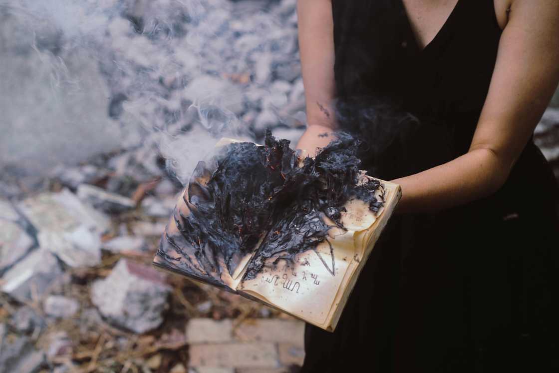 A woman with a burnt book A woman with a burnt book