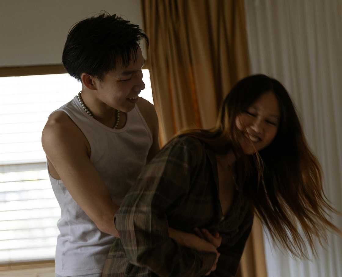 A man teasing his girlfriend