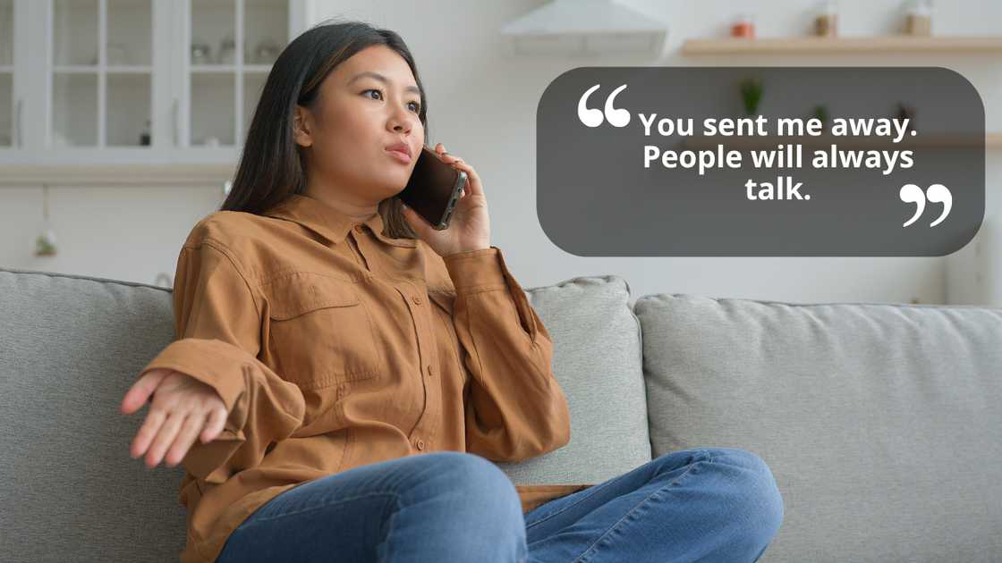 An upset woman sitting on a couch talking using a smartphone An upset woman sitting on a couch talking using a smartphone
