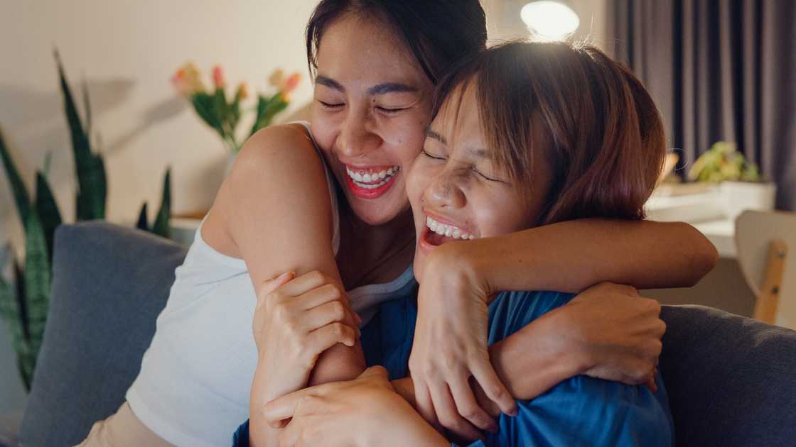 Sisters hug Sisters hug