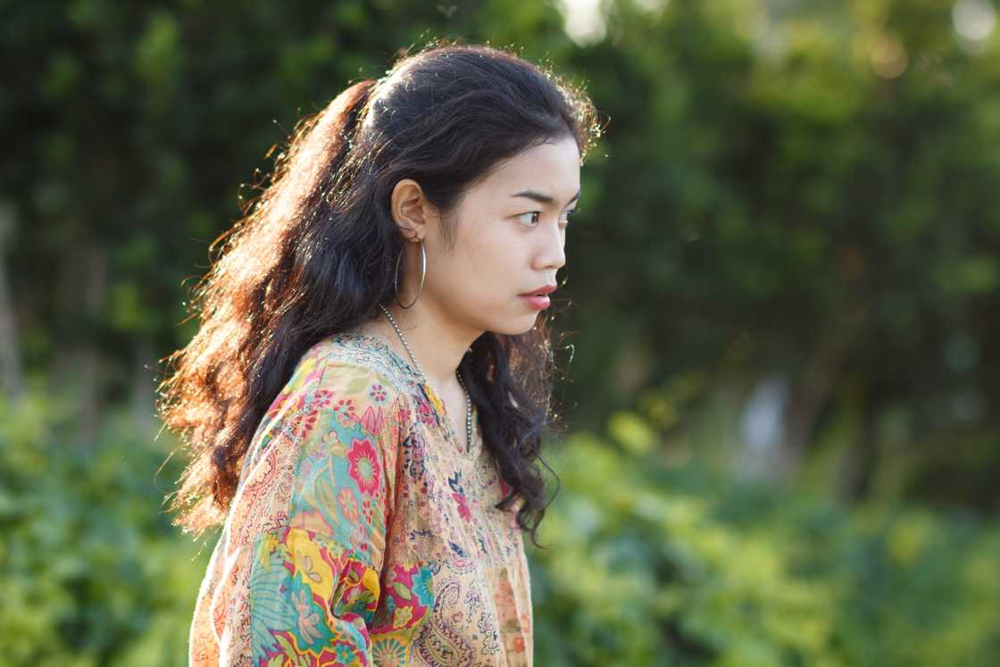 A worried woman in the park