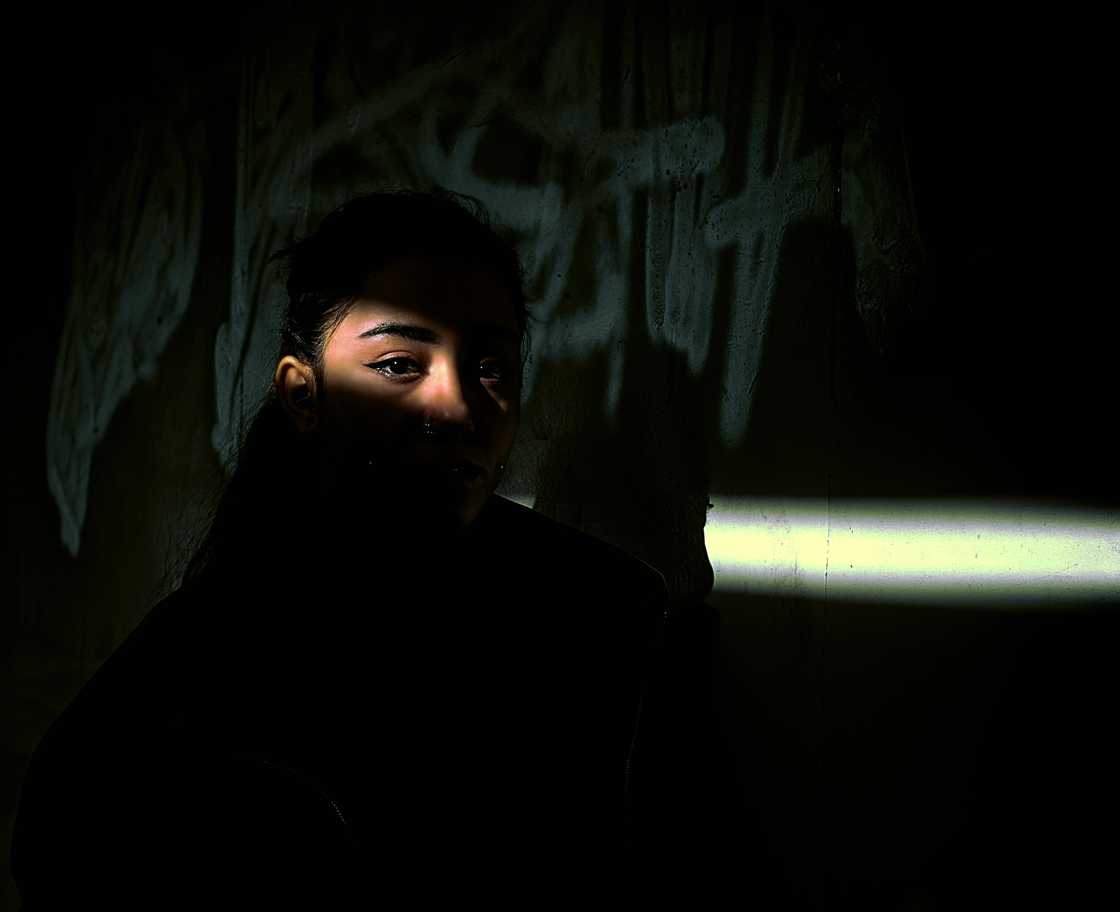 A tense man in a dark room