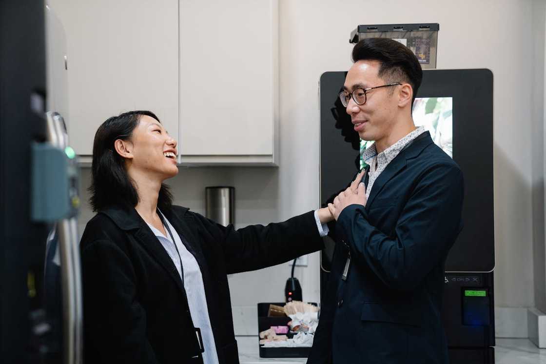 A man and a woman talk together.