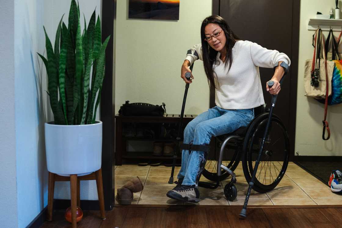A woman using crutches