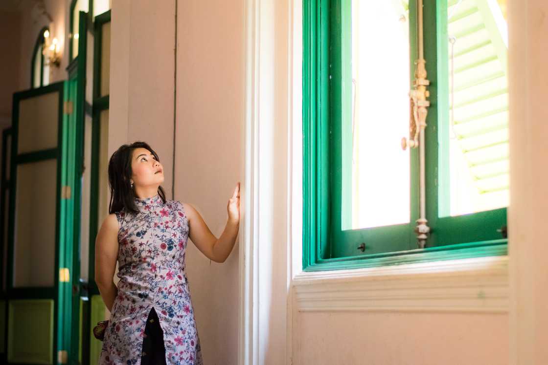 A lady admires her beautiful mansion A lady admires her beautiful mansion