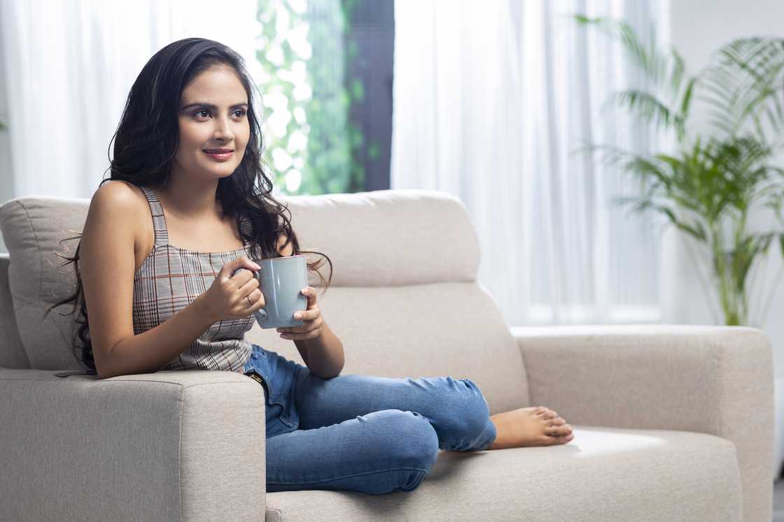 A woman is having tea A woman is having tea