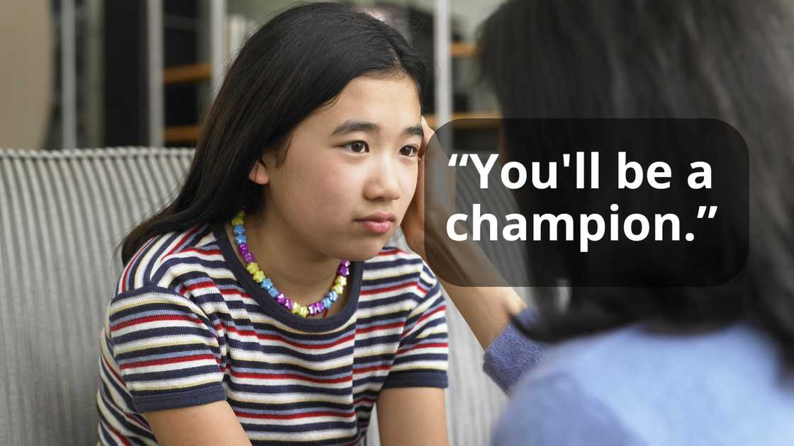 A mother encouraging her daughter A mother encouraging her daughter