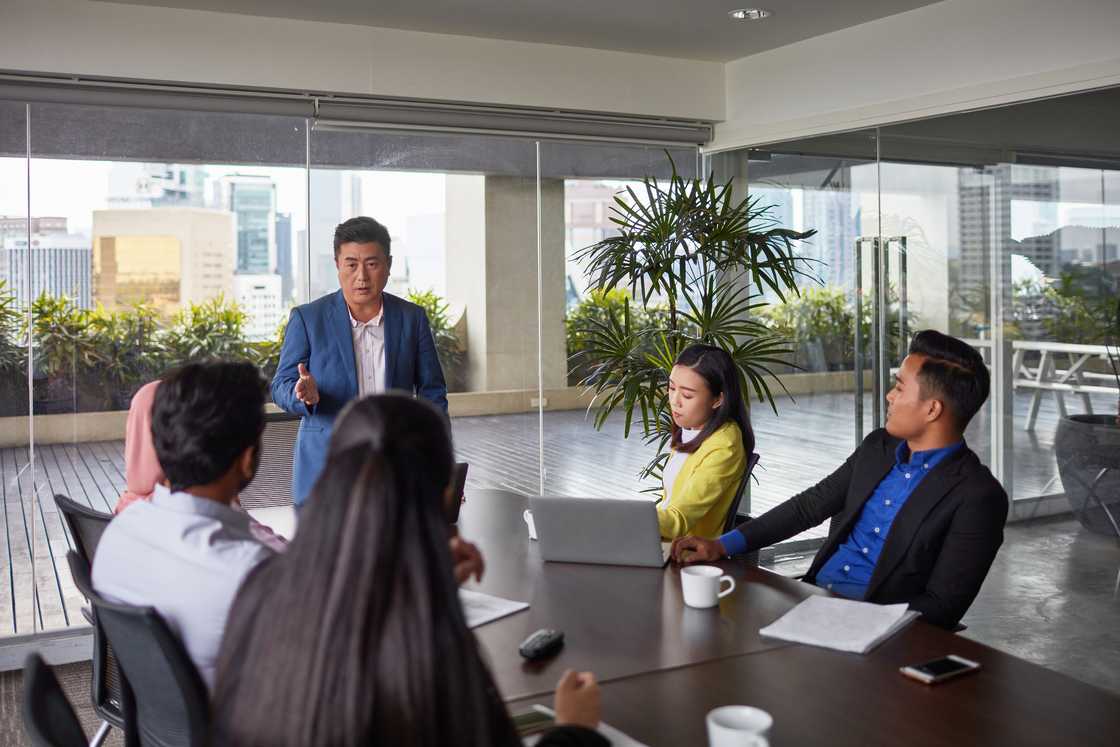 A man leads a meeting A man leads a meeting