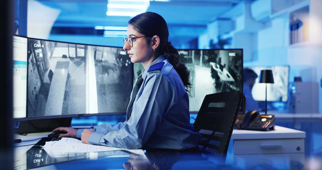 Security personell using a computer in office