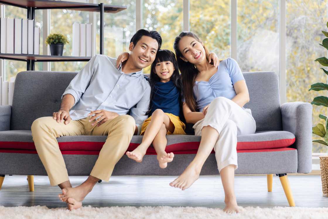 A happy couple and their daughter