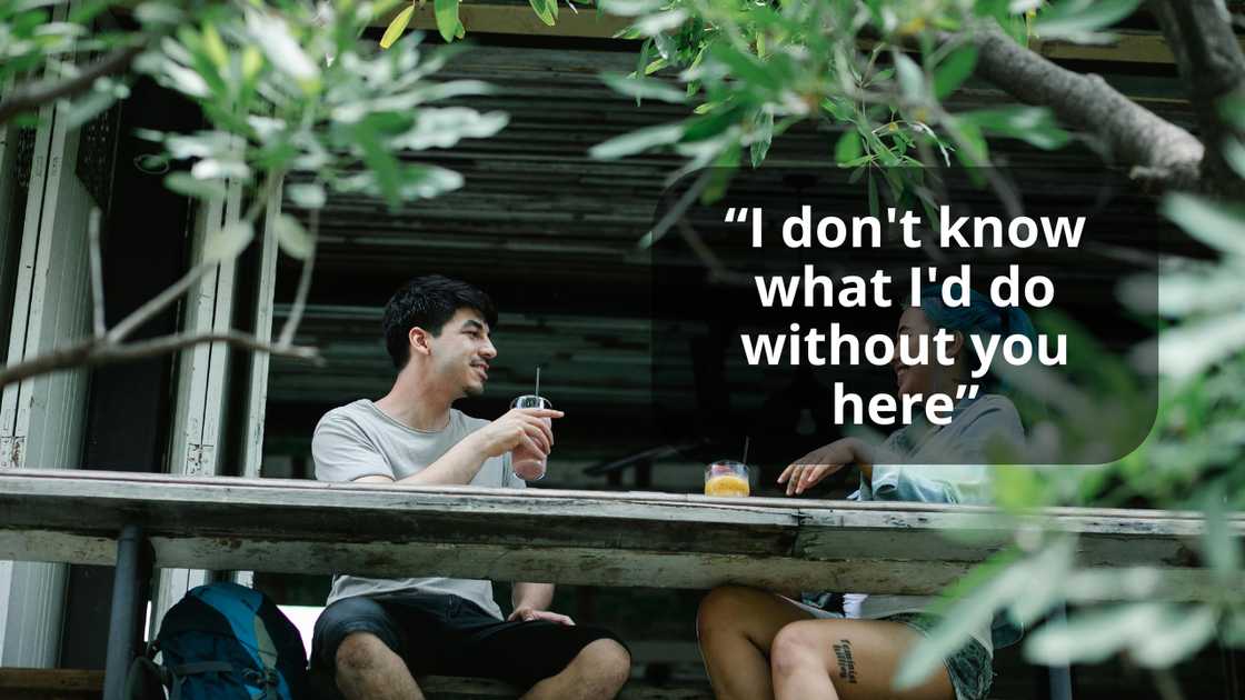 A man chatting with his friend on a terrace