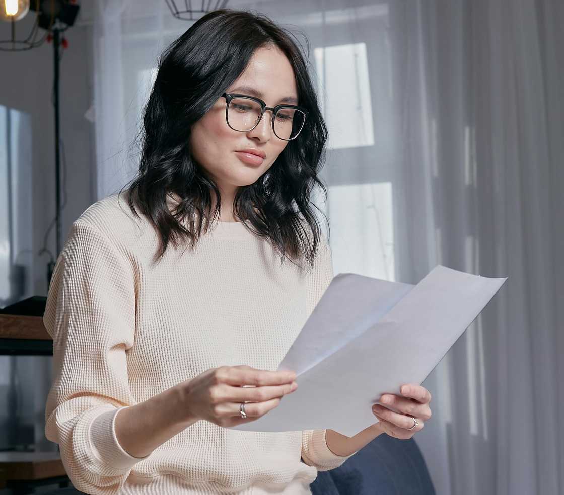 A woman holding documents A woman holding documents