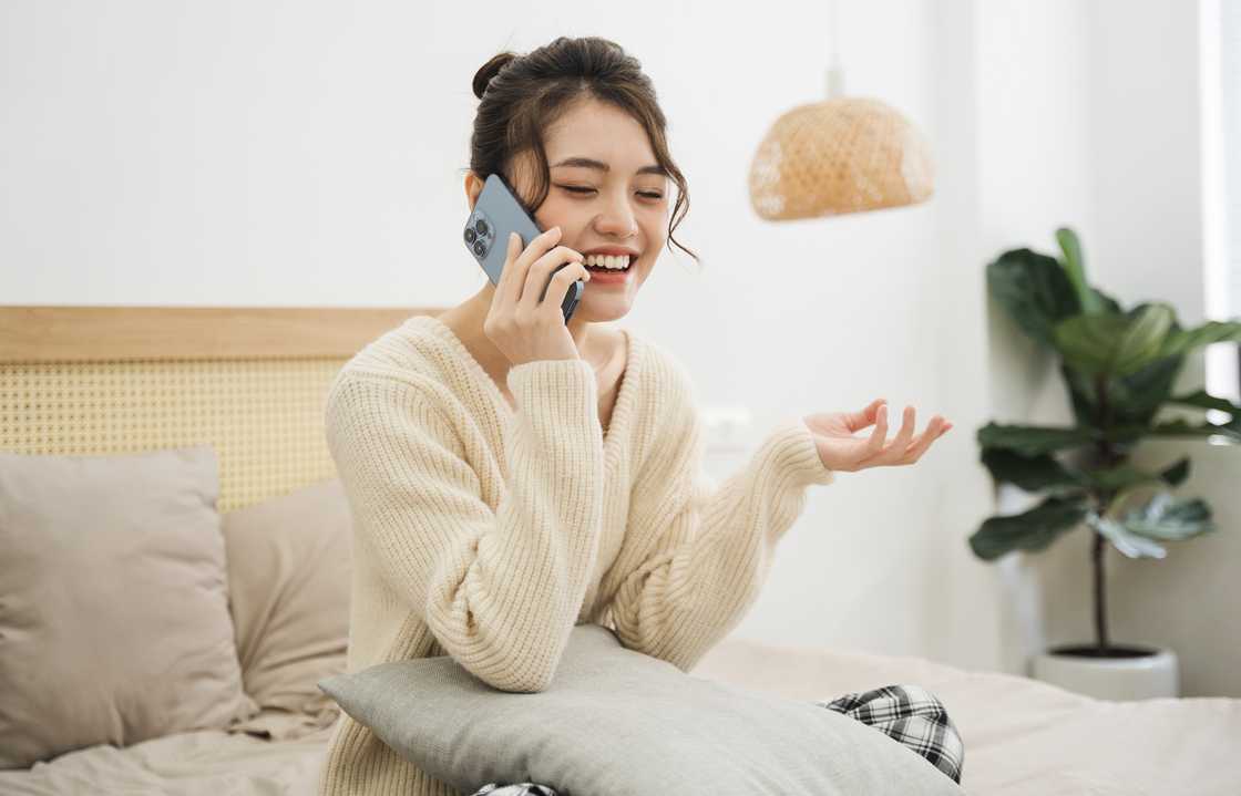 A lady talks on her phone A lady talks on her phone